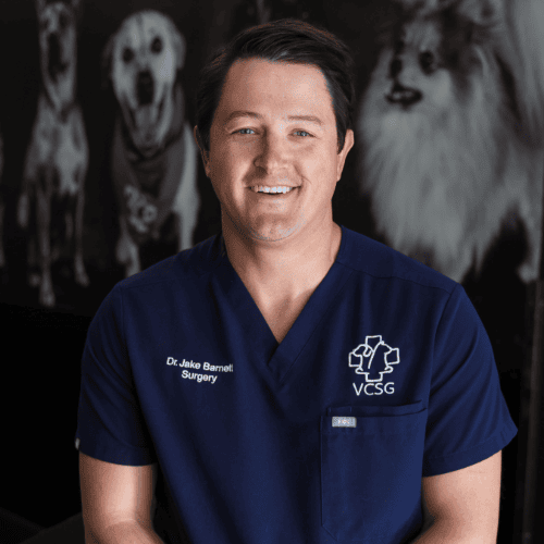 Dr Barnett in blue scubs